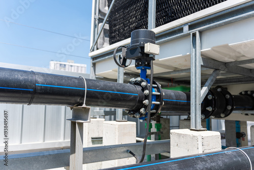 Slika na platnu Industrial butterfly valve with electric actuator installed on polyethylene wate