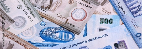 Wallpaper Mural UAE dirham money bills pile on table. United Arab Emirates banknotes of AED currency close up. Torontodigital.ca