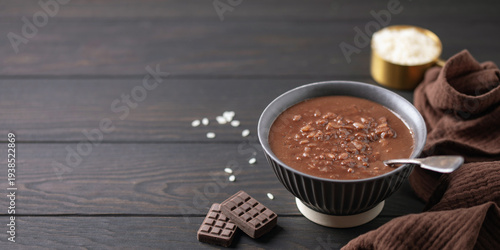 Chocolate champorado. Sweetened flavored porridge. Filipinos cuisine