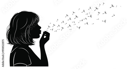 Silhouette of a girl blowing dandelion seeds into the air creating a whimsical and delicate scene
