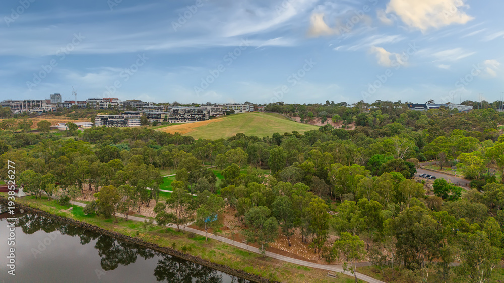 Obraz premium Panoramic Aerial Drone view of Inner Suburbs of Melbourne housing, roof tops, the streets and the parks, the roads and trees of Ascot Vale Moonee Ponds Brunswick Essendon and Maribyrnong in VIC Victor