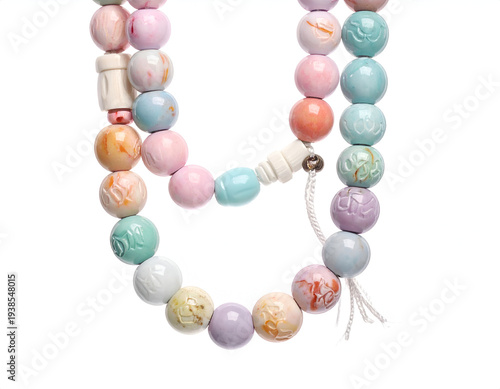 Pastel beaded strands with carved designs and white accents