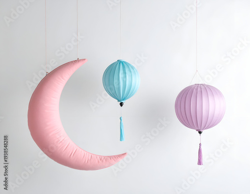 Pink crescent moon with two fabric lanterns hang
