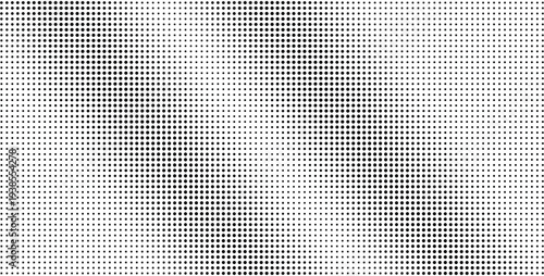 Black dots printed on white paper background