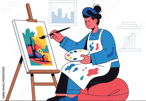 Young woman artist concentrates while painting a colorful abstract scene.