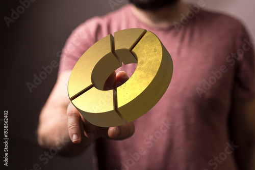 A man's hand presenting a g...