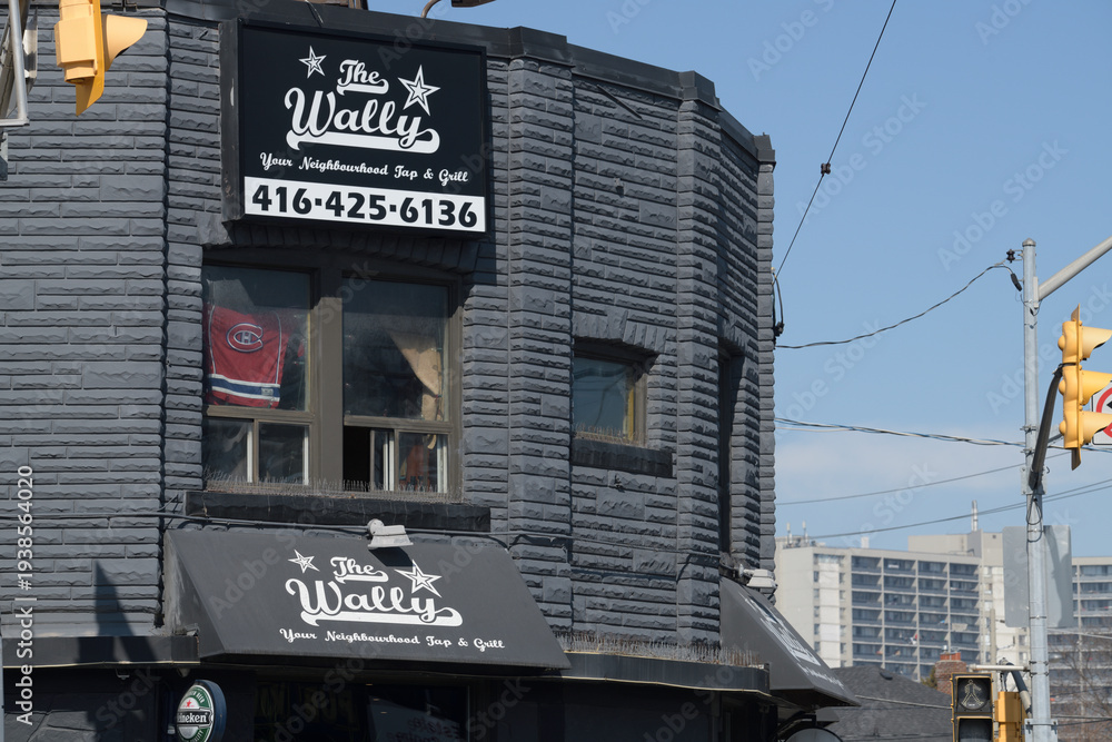 Fototapeta premium exterior building facade and sign of The Wally Tap & Grill located at 302 O'Connor Dr, East York, Toronto