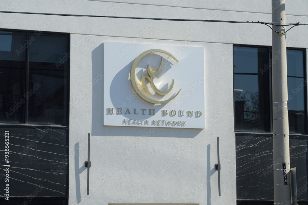 Fototapeta premium facade and sign of Health Bound Health Network - East York Physiotherapy, located at 909 Pape Av, Toronto