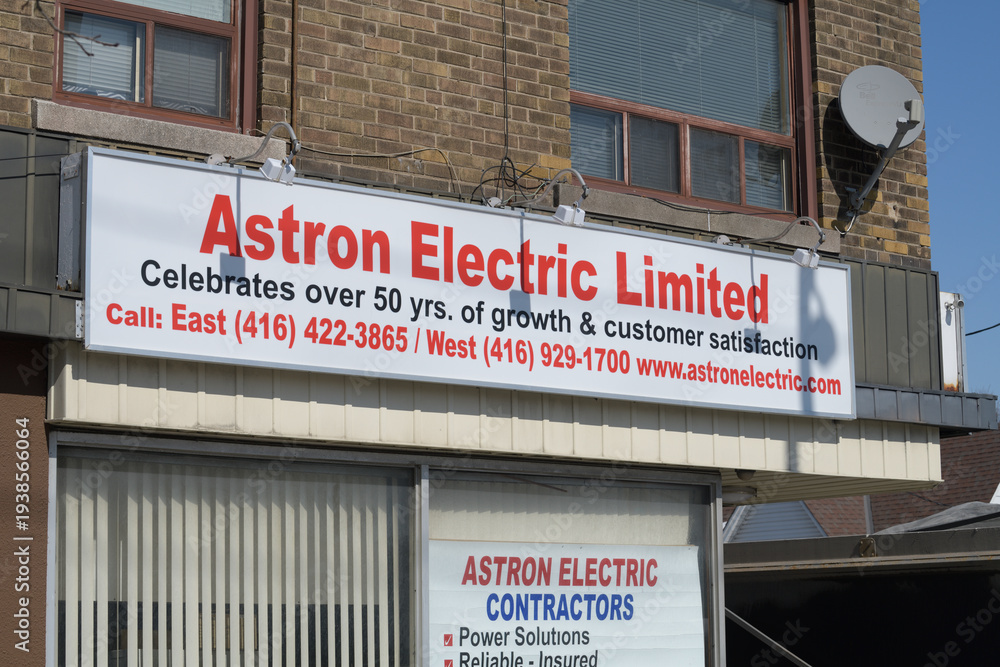 Fototapeta premium exterior building facade and sign of Astron Electric - Licensed Electrician & Electrical Contractors Toronto located at 362 O'Connor Dr, East York, Toronto
