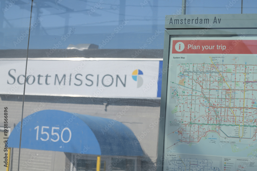 Obraz premium bus shelter (at Amsterdam Av) with route map and defocused view of Scott Mission at 1550 O'Connor Dr, East York, Toronto 