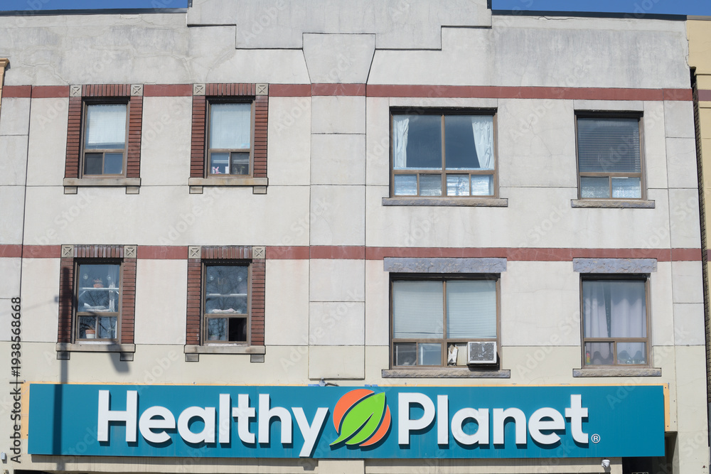 Fototapeta premium exterior building facade and sign of Healthy Planet at 568 Danforth Av, Toronto