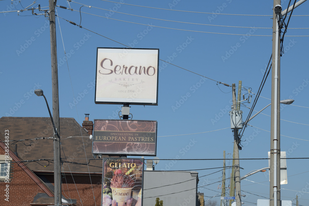 Fototapeta premium old roadside pylon signs at Serano Bakery located at 830 Pape Av, East York, Toronto