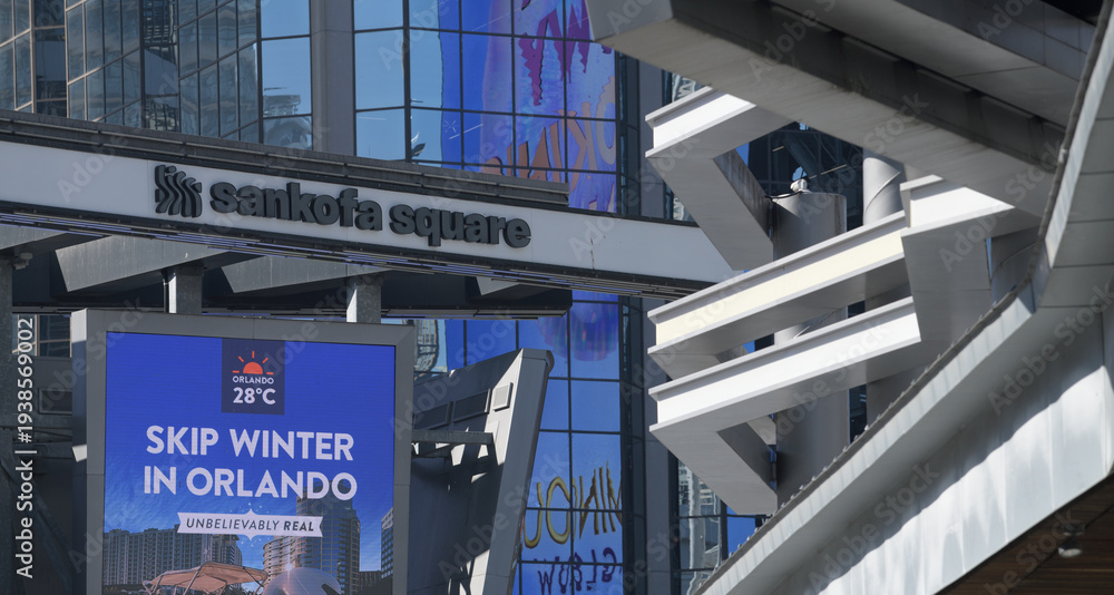 Naklejka premium metal structure and sign at Sankofa Square, incl digital advertising for travel to Orlando, Florida, in Toronto, Canada