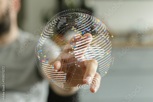Person touching a globe, sy...