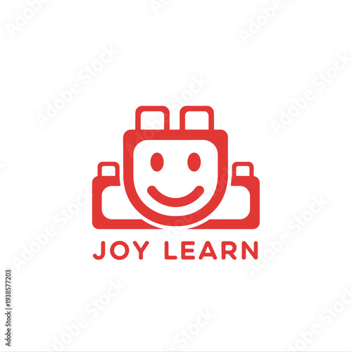 Smiling toy brick block logo for creative children play and educational branding called Joy Learn