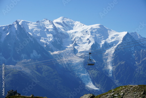 Snowy Swiss Alps with cable car in winter mountain landscape, Switzerland