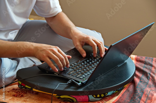A view of an operator working on a notebook at home, Sofia, Bulgaria