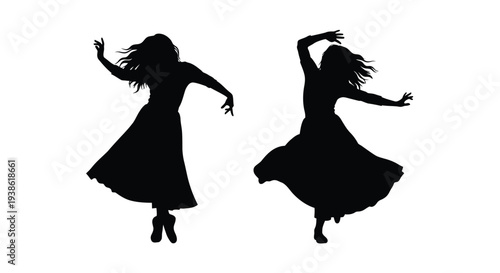 Two dancers in flowing dresses captured as a dramatic silhouette