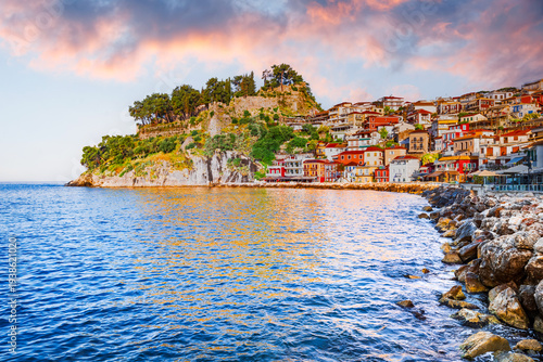 Parga, Greece. Picturesque coastal town in Epirus region, sunrise golden hour and colorful houses.