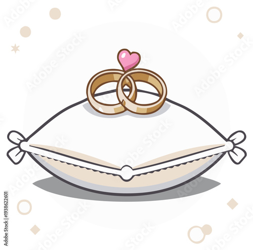 Two golden marriage rings resting on a white ring bearer pillow with a love heart