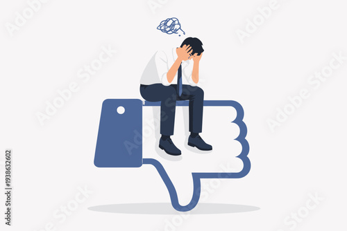 Stressed businessman sitting on a large thumbs down dislike icon, feeling demotivated and exhausted from negative feedback, failure, or burnout at work, mental health and social media concept.