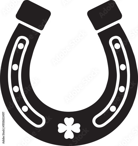 A lucky black horseshoe with a charming four leaf clover on a white background