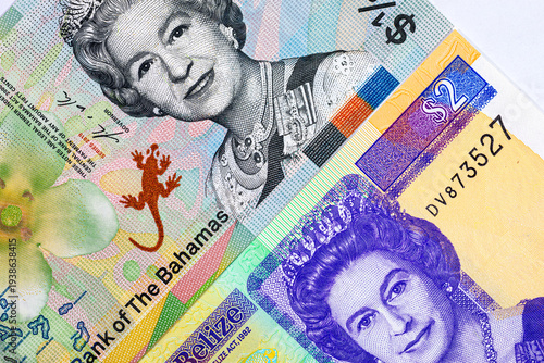 2 Dollars Belize and 1/2 Dollars Bahamas with a portrait of Queen Elisabeth II. Money of the colonies of Great Britain.
