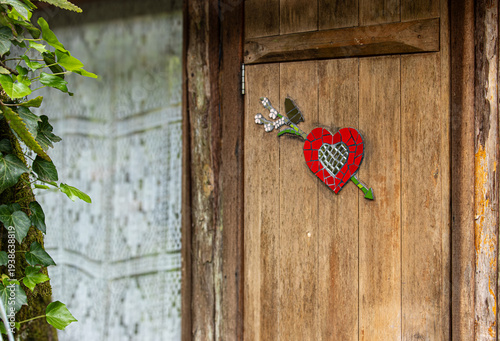red heart on wooden door