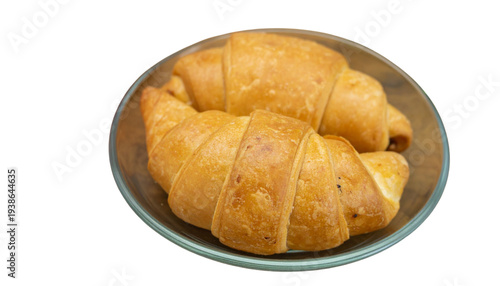 A plate of golden croissants on a white background with transparent background