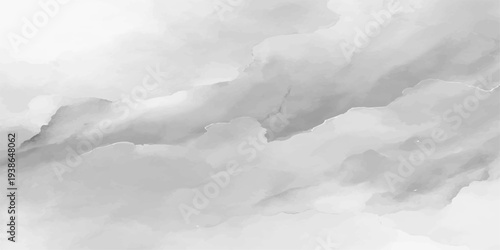 Beautiful view of fluffy white clouds drifting over snow covered mountains under a bright blue winter sky