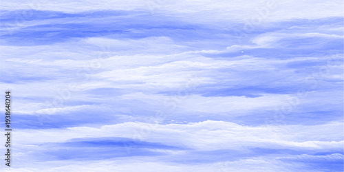 Beautiful summer day featuring fluffy white cumulus clouds drifting across a clear blue sky as bright sunlight illuminates the natural beauty of the airy atmosphere