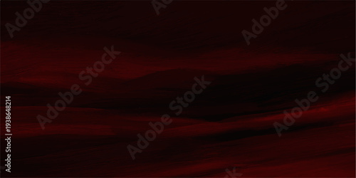 Beautiful sunset sky with abstract red and black clouds over a dark nature landscape at twilight dusk