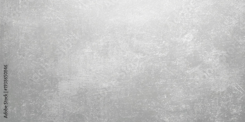 Old dark grey brushed metal plate texture with a grunge vintage pattern on a rough aged concrete surface backdrop