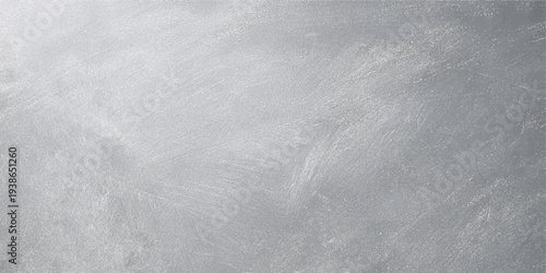 A rough gray grunge texture features cold winter frost and dirty snow patterns on an old vintage wall surface for a blank Christmas backdrop design