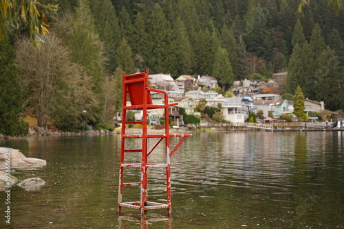 Red chair by the water