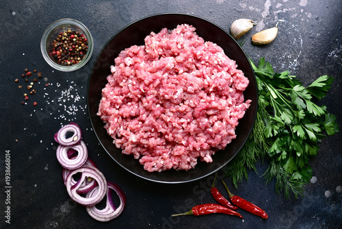 Homemade minced meat with spices. Top view with copy space.
