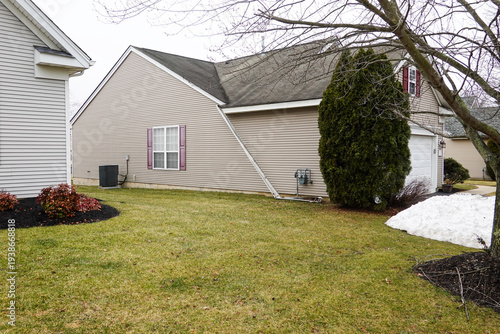 Gutter that has broken away from the side of a house