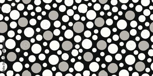 Abstract pattern of varying-sized circles on a contrasting background Vector