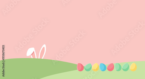 Easter bunny ears peeking over a green hill with colorful eggs