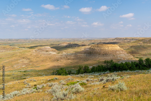 Prairie Badlands With Vibrant Geologic Bands