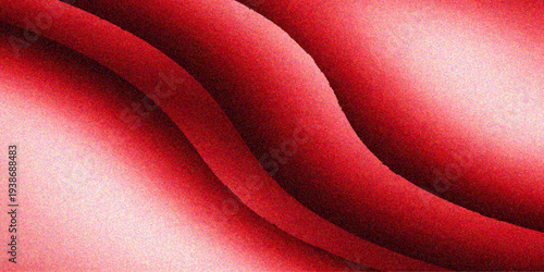 A smooth wave of luxury red silk fabric creates a shiny satin texture with soft pink highlights, forming a romantic abstract backdrop perfect for Valentine decoration