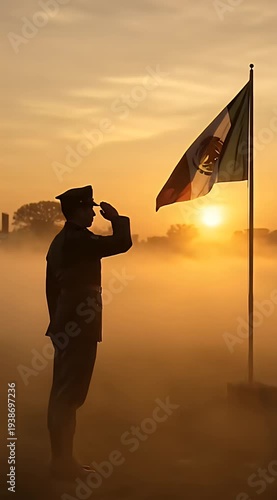 Silhouette of Soldier Saluting Flag at Sunrise in Misty Field