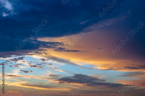 Dramatic beautiful sky background with clouds. Bottom-up view. Nature concept for design or for adding text. Abstract background with a natural sky. Close-up.