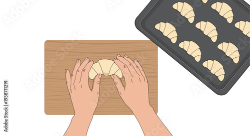 A pair of hands is carefully shaping a croissant on a light wooden board, next to a baking tray filled with other unbaked pastries.