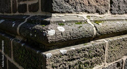 Weathered stone corner showcasing timeworn texture and nature's resilience