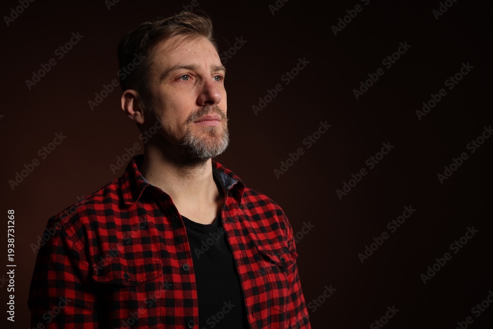 Obraz premium Man with beard on dark background. Space for text