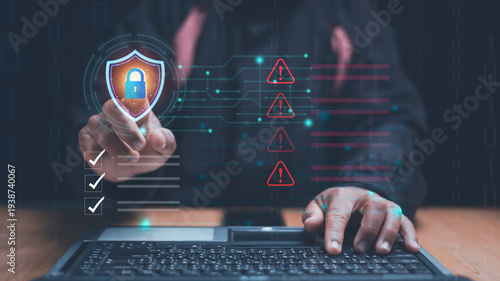 Cyber security and data protection concept. Businessman pointing at digital shield with lock icon. Cybersecurity, network protection, data privacy, risk management and secure information technology.