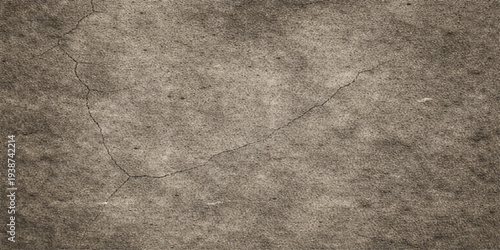 An aged vintage design featuring a dark grunge stone wall and brown old paper texture background with a rough grey concrete pattern surface