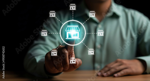 Businessman touching glowing storefront icon representing franchise business and retail network