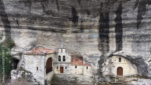 Ojo guareña hermitage built into rock cliff